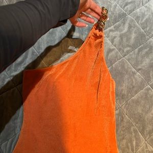 One shoulder orange top - stretchy material with gold chain detail